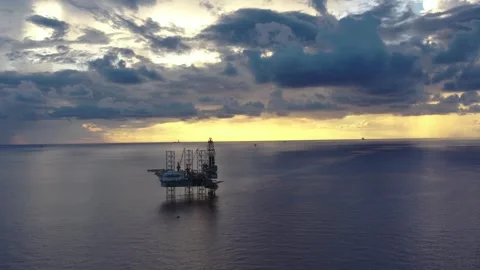 Aerial view of offshore jack up rig and offshore platform during sunset Stock Footage 320970251