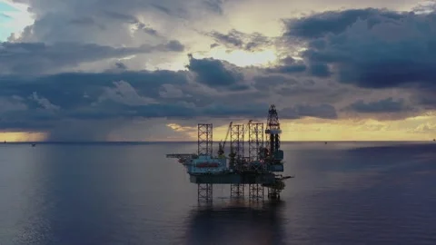 Aerial view of offshore jack up rig and offshore platform during sunset Stock Footage 320970265