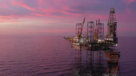 Aerial view of offshore jack up rig and offshore platform during sunset Stock Footage 321033728