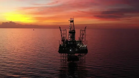 Aerial view of offshore jack up rig and offshore platform during sunset Stock Footage 321033736
