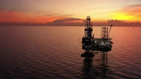 Aerial view of offshore jack up rig and offshore platform during sunset Stock Footage 321033741