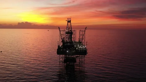 Aerial view of offshore jack up rig and offshore platform during sunset Stock Footage 321033745