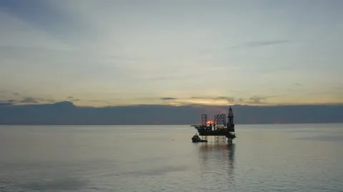 Aerial view of offshore jack up rig and offshore platform during sunset Stock Footage 322971852