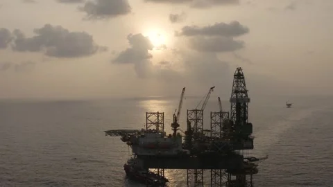 Aerial view of offshore jack up rig and offshore platform during sunset Stock Footage 323336902