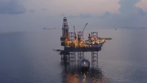 Aerial view of offshore jack up rig and offshore platform during sunset Stock Footage 325465945