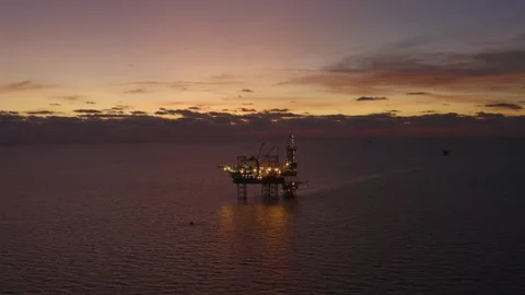 Aerial view of offshore jack up rig and offshore platform during sunset Stock Footage 327357364