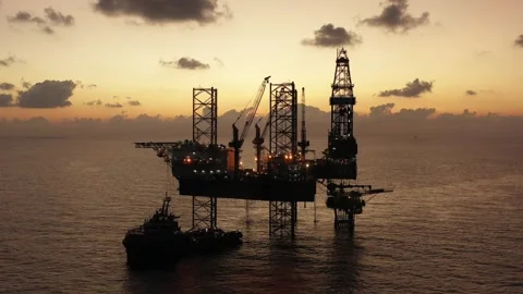 Aerial view of offshore jack up rig and offshore platform during sunset Stock Footage 328687791