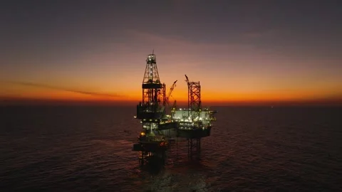 Aerial view of offshore jack up rig and offshore platform during sunset Stock Footage 329196403
