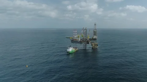 Aerial view of offshore jack up rig and offshore platform during sunset Stock Footage 329196405