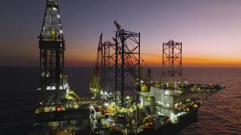 Aerial view of offshore jack up rig and offshore platform during sunset 動画素材 329451102