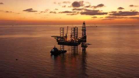 Aerial view of offshore jack up rig and offshore platform during sunset Stock Footage 332444919