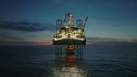 Aerial view of offshore jack up rig and offshore platform during sunset Видео 333076619