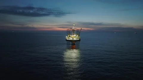 Aerial view of offshore jack up rig and offshore platform during sunset Stock Footage 333076620