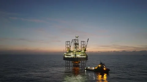 Aerial view of offshore jack up rig and offshore platform during sunset 動画素材 334162160