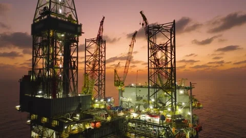 Aerial view of offshore jack up rig and offshore platform during sunset Stock Footage 336342709