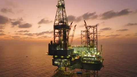 Aerial view of offshore jack up rig and offshore platform during sunset Stock Footage 336342719
