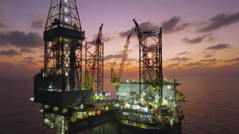 Aerial view of offshore jack up rig and offshore platform during sunset Stock Footage 336342722