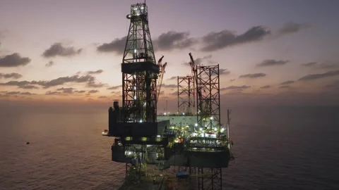 Aerial view of offshore jack up rig and offshore platform during sunset Stock Footage 336342736