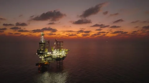 Aerial view of offshore jack up rig and offshore platform during sunset Stock Footage 336342774