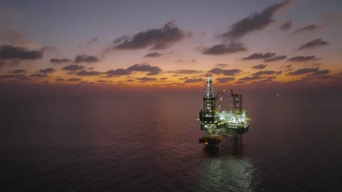 Aerial view of offshore jack up rig and offshore platform during sunset Stock Footage 336342784