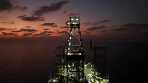 Aerial view of offshore jack up rig and offshore platform during sunset Stock Footage 336342792