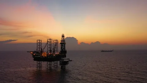 Aerial view of offshore jack up rig and offshore platform during sunset 動画素材 337672499
