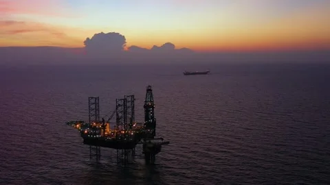 Aerial view of offshore jack up rig and offshore platform during sunset 動画素材 337672502