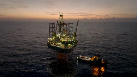 Aerial view of offshore jack up rig and offshore platform during sunset 스톡 동영상 337974616