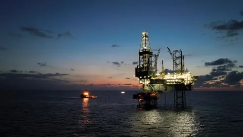 Aerial view of offshore jack up rig and offshore platform during sunset Видео 337974677