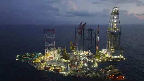 Aerial view of offshore jack up rig and offshore platform during sunset 動画素材 338036034