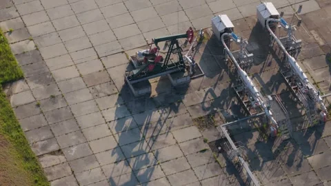 Aerial view of an oil pump jack and industrial pipes, Czechia. Stock Footage 334915535