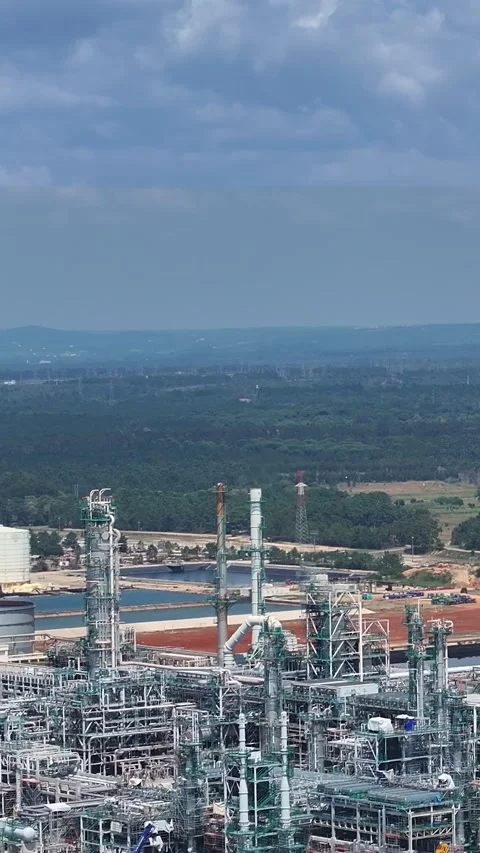 Aerial view of oil refinery complex in operation during daytime hours Stock Footage 339730923
