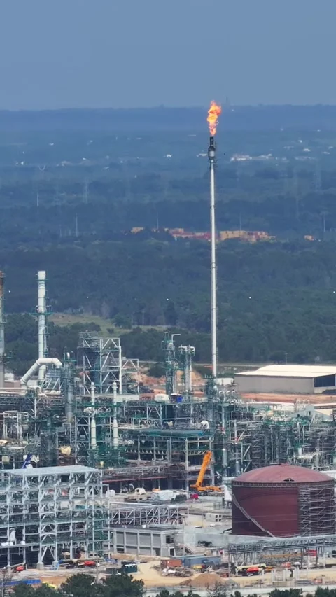 Aerial view of oil refinery complex with gas flaring Stock Footage 339731484