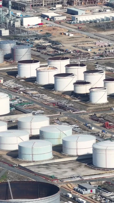 Aerial view of oil refinery complex with fuel storage tanks and processing units Stock Footage 339731867