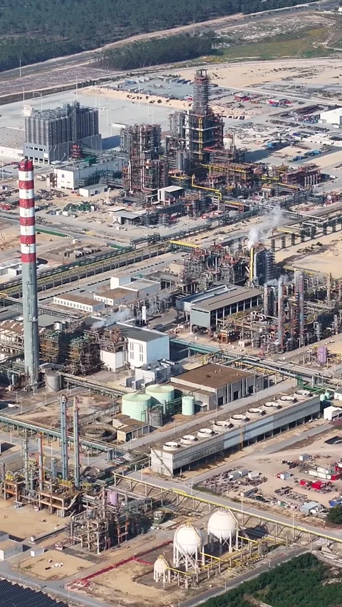 Aerial view of an oil refinery complex with storage tanks and pipelines Stock Footage 339732021