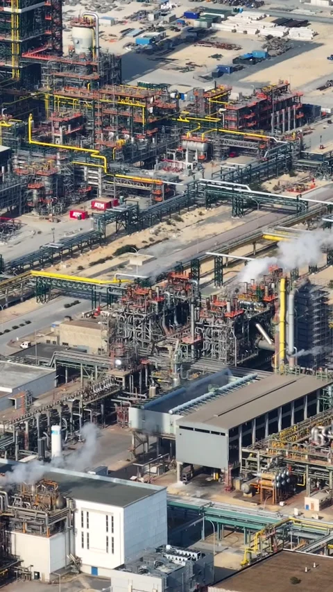 Aerial view of oil refinery complex with industrial infrastructure and tanks Stock Footage 339732706