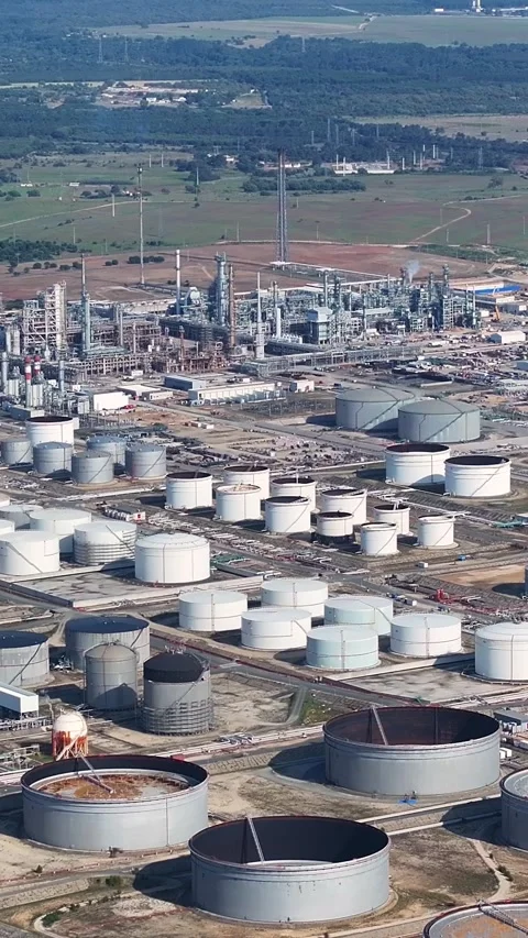 Aerial view of oil refinery complex with storage tanks and processing plants Stock Footage 340813845