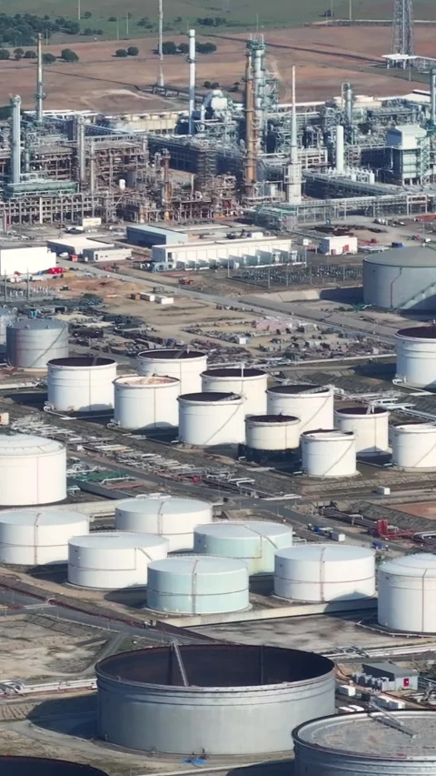 Aerial view of oil refinery complex with storage tanks in operation Stock Footage 341870656