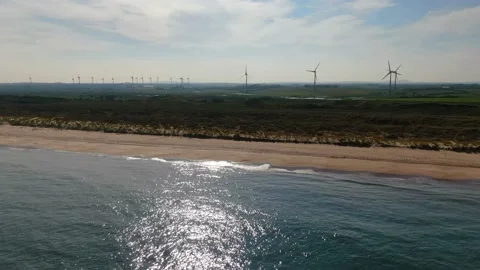 An aerial view of Old Bawn beach and Ballywater Wind Farm in County Wexford. Stock Footage 155354477