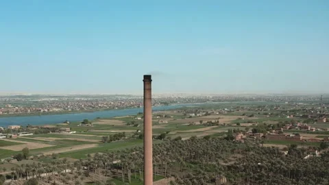 Aerial view of Old big pipe or chimney  in the city. Old brick factory. Stock-Footage 154972311