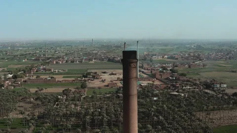 Aerial view of Old big pipe or chimney  in the city. Old brick factory. Stock Footage 154972756