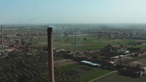Aerial view of Old big pipe or chimney  in the city. Old brick factory. Stock Footage 154972874