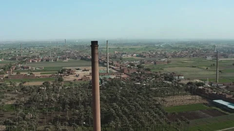 Aerial view of Old big pipe or chimney  in the city. Old brick factory. Stock Footage 154972920