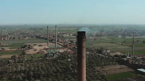 Aerial view of Old big pipe or chimney  in the city. Old brick factory. Stock-Footage 154973101