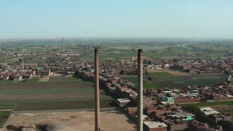 Aerial view of Old big pipe or chimney  in the city. Old brick factory. Stock-Footage 154987265