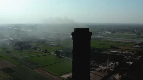 Aerial view of Old big pipe or chimney  in the city. Old brick factory. Stock-Footage 154987791