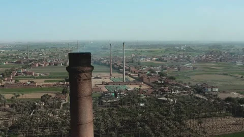 Aerial view of Old big pipe or chimney  in the city. Old brick factory. Stock-Footage 154989937