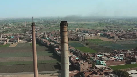 Aerial view of Old big pipe or chimney  in the city. Old brick factory. Stock Footage 154991847