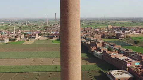 Aerial view of Old big pipe or chimney  in the city. Old brick factory. Stock Footage 154996958