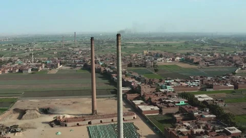 Aerial view of Old big pipe or chimney  in the city. Old brick factory. Stock-Footage 154997449